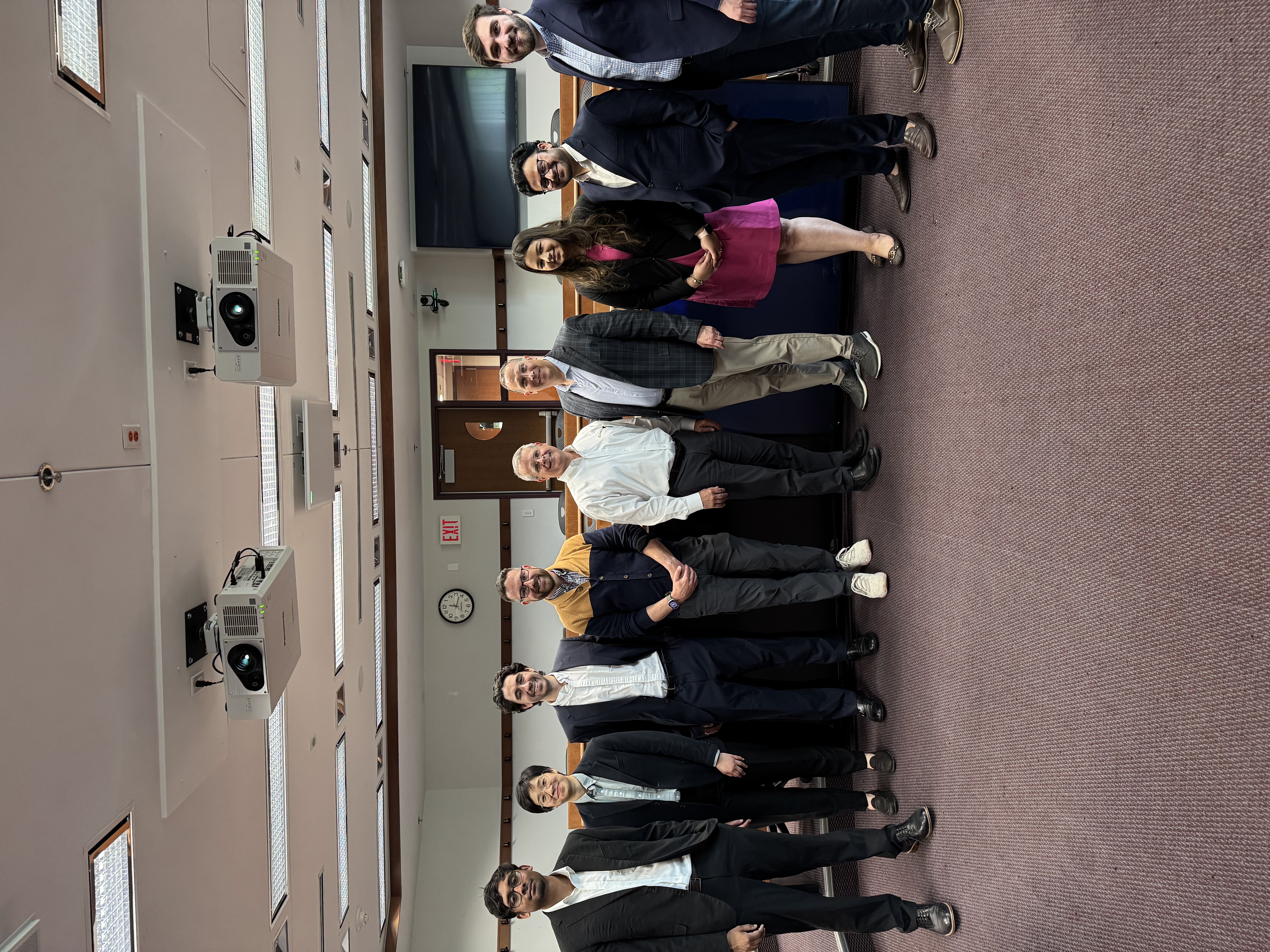 Group of students with guest speakers in a Babson classroom