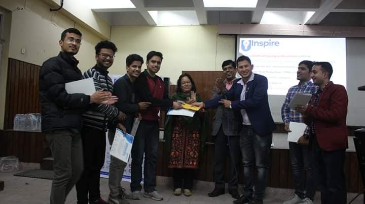 Group receiving award certificates at a youth hackathon event in Nepal