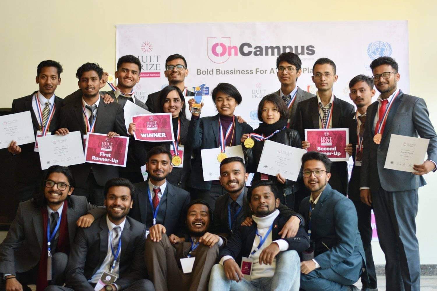 All winners at the Hult Prize OnCampus competition with trophies and certificates