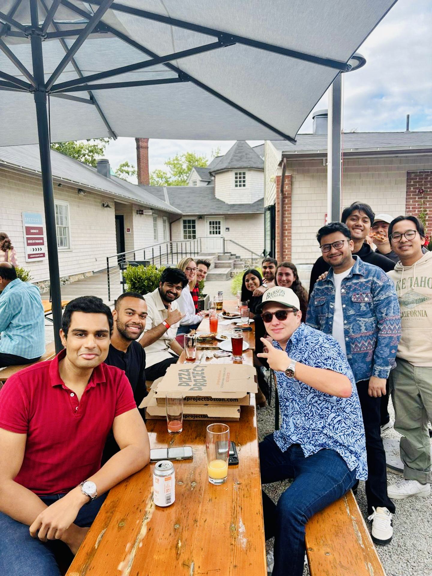 Group of MBA students enjoying an outdoor lunch at Babson College